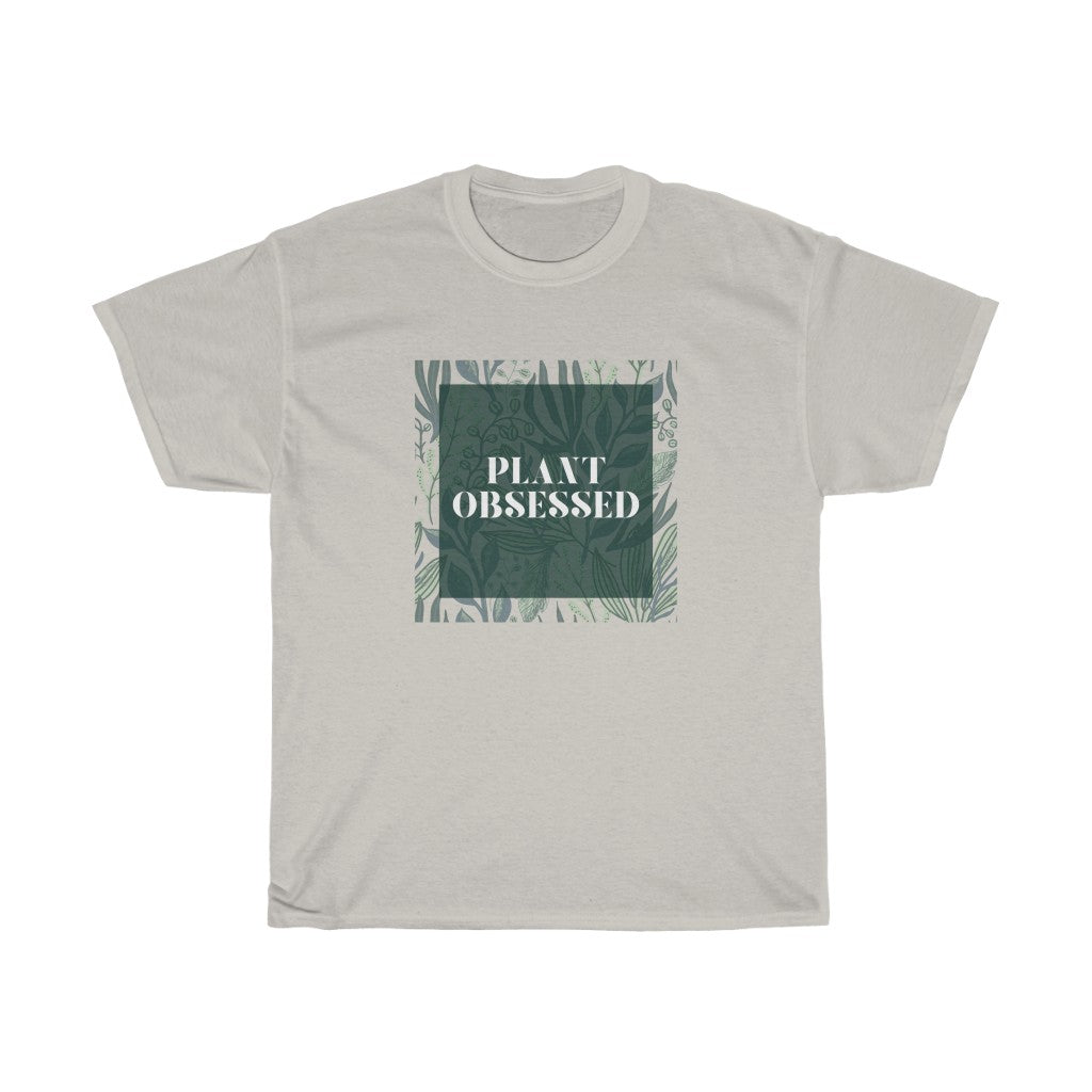 Calling all plant lovers. This plant obsessed cotton t-shirt has a gorgeous plant leaf design with the phrase Plant Obsessed. Whether you are just starting out your plant journey or your living space has become a jungle, this t-shirt is for you.