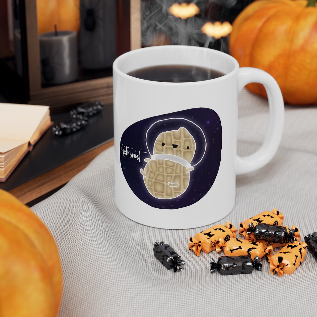 What do you get when you cross an astronaut and a peanut?... an Astronut! Show off your sense of humor in this funny, galactic, out of this world ceramic mug. Makes the perfect gift for your punny uncle or for your friend who can't stop making dad jokes! This mug is 11 oz, lead and BPA free, and microwave and dishwasher safe!