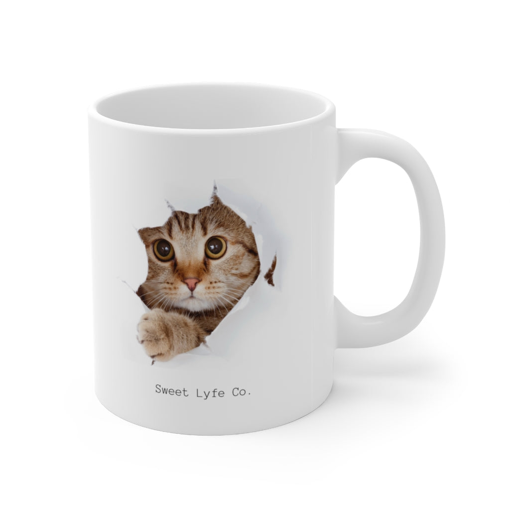 Calling all cat lovers! This cute cat mug has a cat peeking out. This mug is perfect for all cat moms and dads out there. This mug is 11 oz, lead and BPA free, and microwave and dishwasher safe!