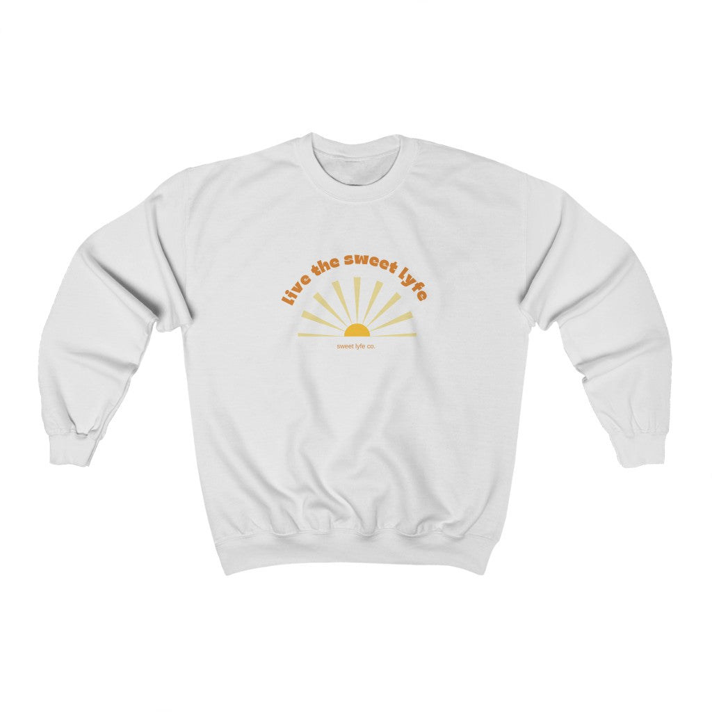 Sunshine is good for the mind, body, adn soul. Live the sunny sweet lyfe with this retro graphic crewneck sweatshirt. With both comfort and style in mind, this sweatshirt is made with a plush cotton that is great for sunny days. Step up your style and add this to your wardrobe today.