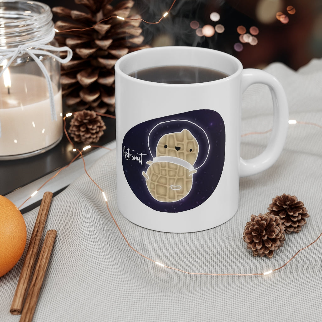 What do you get when you cross an astronaut and a peanut?... an Astronut! Show off your sense of humor in this funny, galactic, out of this world ceramic mug. Makes the perfect gift for your punny uncle or for your friend who can't stop making dad jokes! This mug is 11 oz, lead and BPA free, and microwave and dishwasher safe!