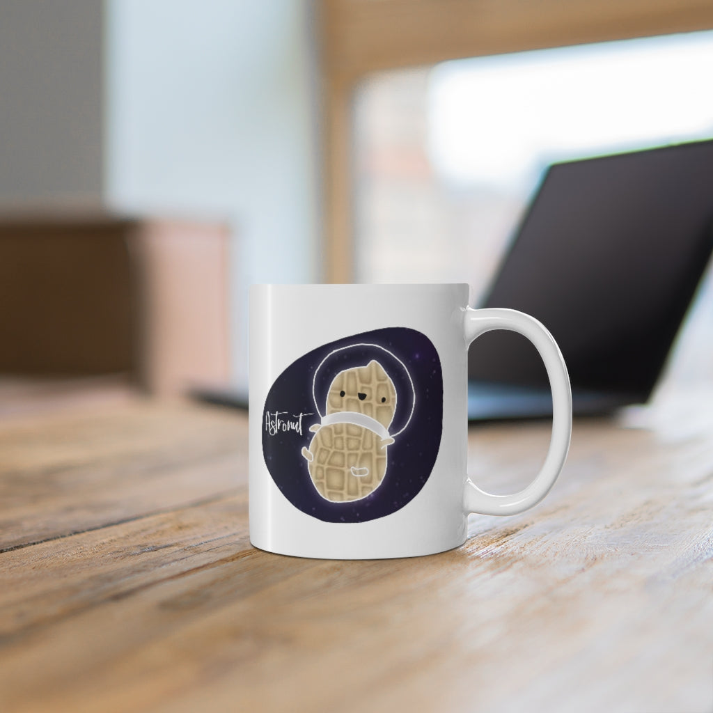 What do you get when you cross an astronaut and a peanut?... an Astronut! Show off your sense of humor in this funny, galactic, out of this world ceramic mug. Makes the perfect gift for your punny uncle or for your friend who can't stop making dad jokes! This mug is 11 oz, lead and BPA free, and microwave and dishwasher safe!