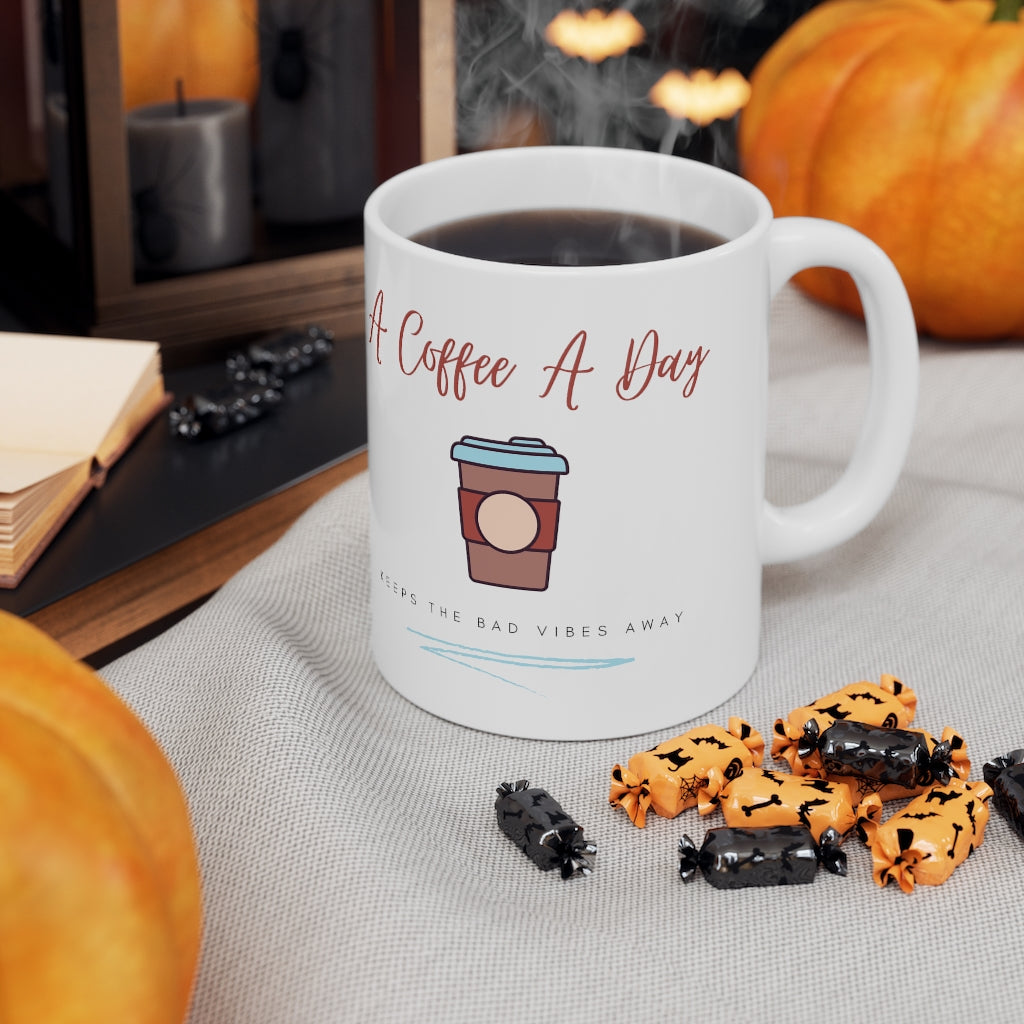 Keep the bad vibes away with a coffee (or two) a day.  This funny ceramic mug shows off your love for caffeine. Designed for the girl who loves coffee and has great style.  This mug is 11 oz, lead and BPA free, and microwave and dishwasher safe! 