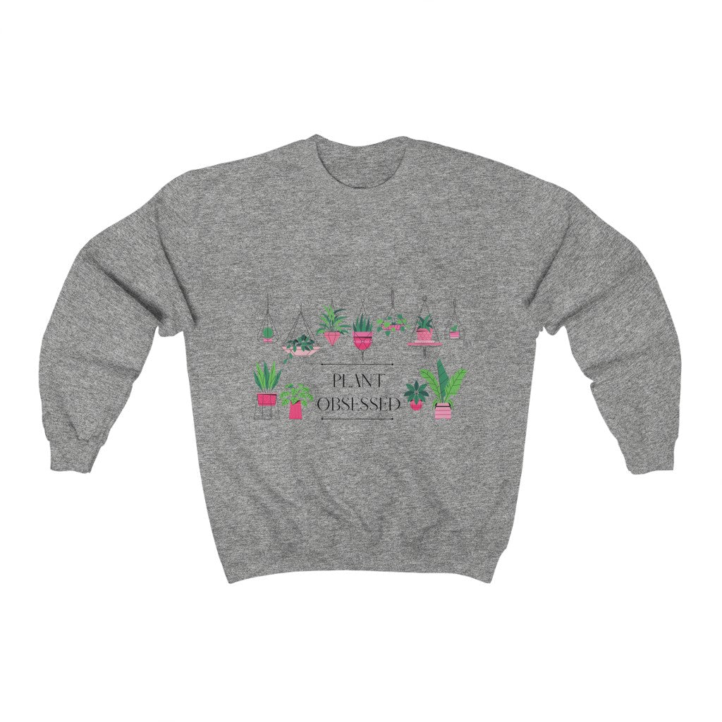 There is no such thing as too many plants. I mean, just one more right? This colorful crewneck sweatshirt has beautiful hanging plants and the phrase “Plant Obsessed”. Made with 100% cotton, this sweatshirt is both stylish and cozy. Treat yourself and show off your passion for plants with this piece.