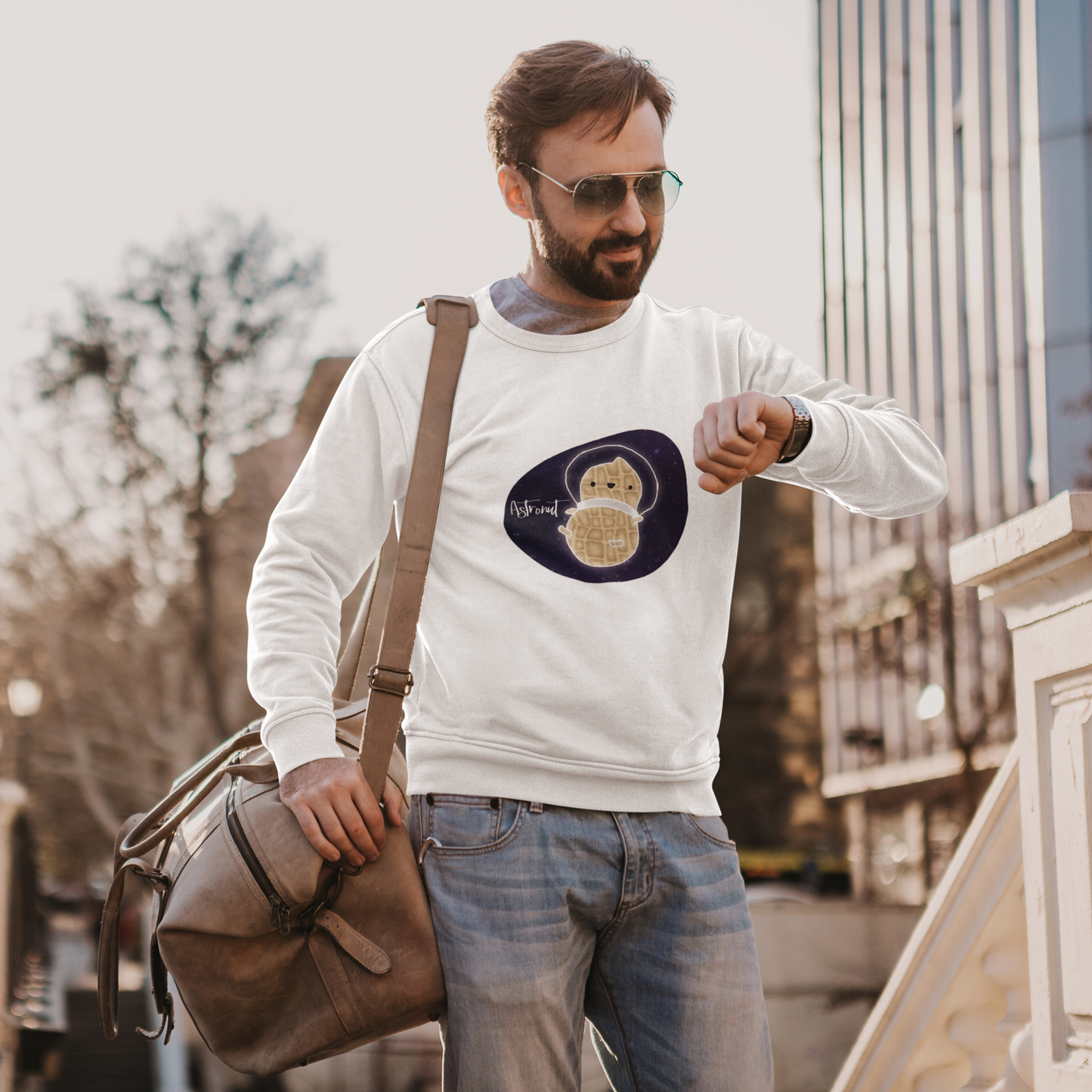 What do you get when you cross an astronaut and a peanut?... an Astronut! Show off your sense of humor in this funny, galactic, out of this world crewneck sweatshirt. Makes the perfect gift for your punny uncle or for your friend who can't stop making dad jokes!