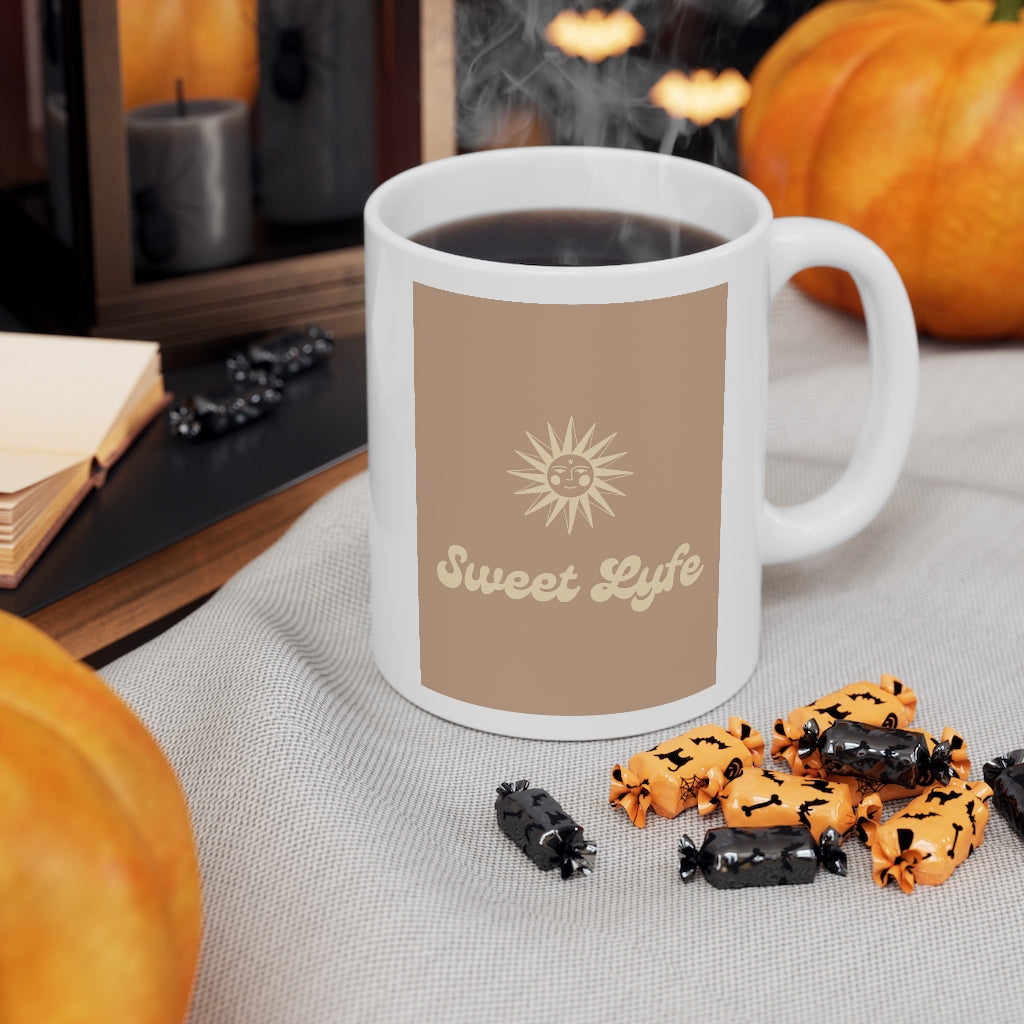 Wherever you go, always bring your own sunshine.  This neutral ceramic mug features a sunny design that includes our brand Sweet Lyfe.  Upgrade your style and add this mug to your collection today.  This mug is 11 oz, lead and BPA free, and microwave and dishwasher safe! 