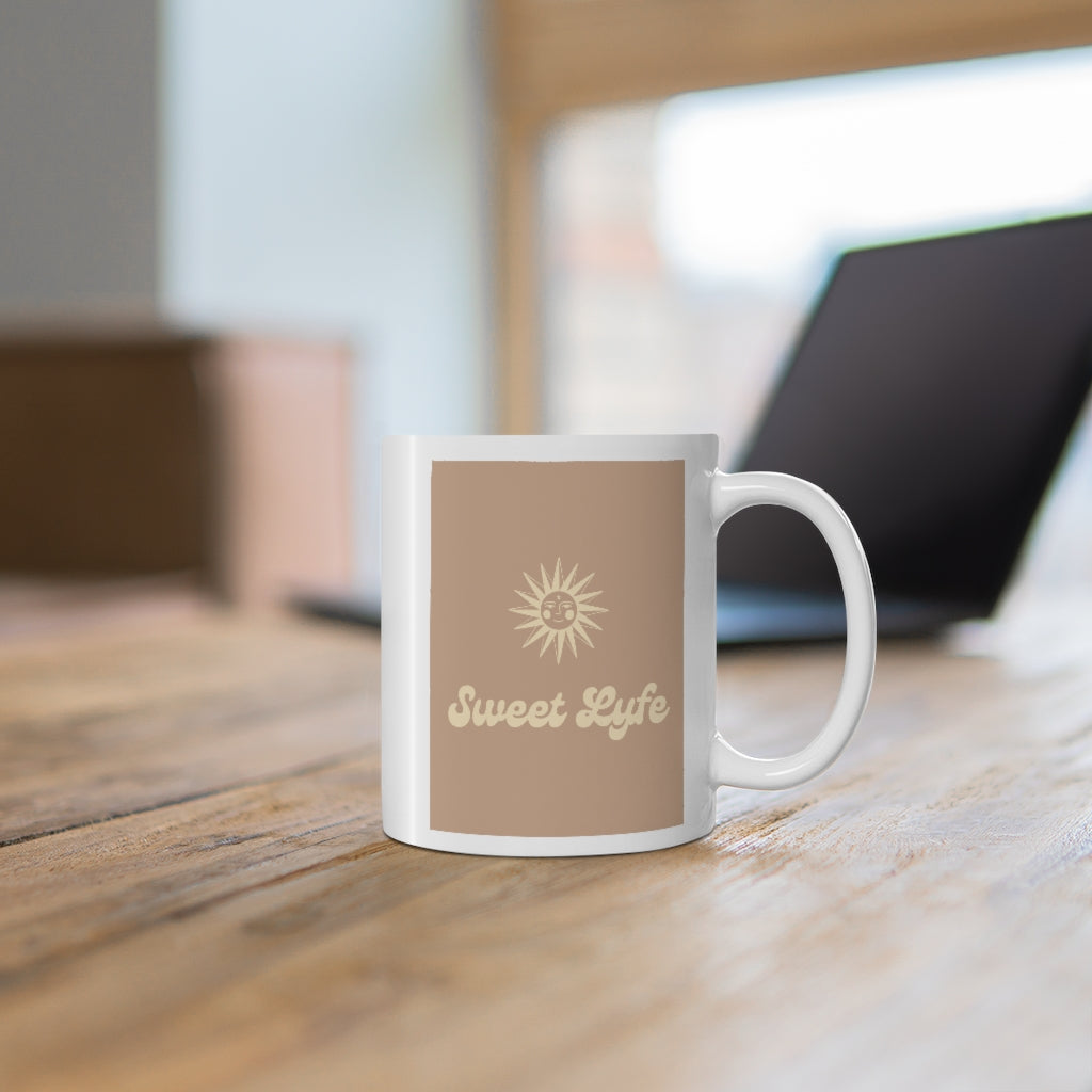 Wherever you go, always bring your own sunshine.  This neutral ceramic mug features a sunny design that includes our brand Sweet Lyfe.  Upgrade your style and add this mug to your collection today.  This mug is 11 oz, lead and BPA free, and microwave and dishwasher safe! 