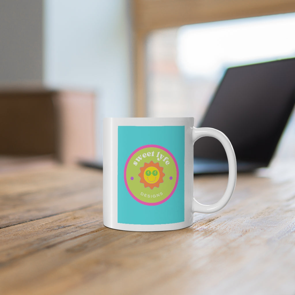 This bright fun colorful ceramic mug has a retro design with a sun wearing sunglasses.  With fun pops of color, this cute mug is a unique piece to add to your collection.  Make people smile and show off your style and always remember you are living the sweet lyfe. This mug is 11 oz, lead and BPA free, and microwave and dishwasher safe! 