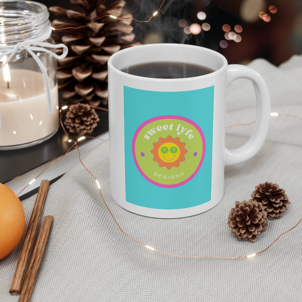 This bright fun colorful ceramic mug has a retro design with a sun wearing sunglasses.  With fun pops of color, this cute mug is a unique piece to add to your collection.  Make people smile and show off your style and always remember you are living the sweet lyfe. This mug is 11 oz, lead and BPA free, and microwave and dishwasher safe! 