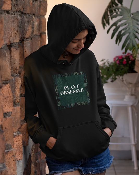 Calling all plant lovers. This plant obsessed hoodie sweatshirt has a gorgeous plant leaf design with the phrase Plant Obsessed. Whether you are just starting out your plant journey or your living space has become a jungle, this sweatshirt is for you.