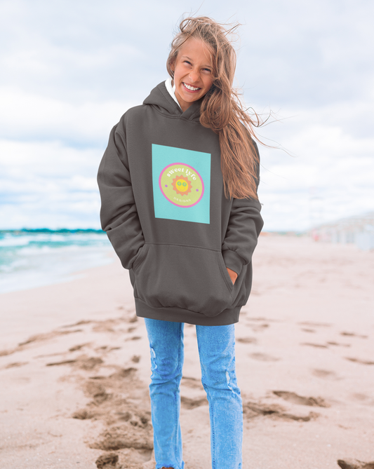 This bright fun colorful hoodie has a retro design with a sun wearing sunglasses. With fun pops of color, this cute graphic sweatshirt is a unique piece to add to your collection. Make people smile and show off your style and always remember you are living the sweet lyfe.