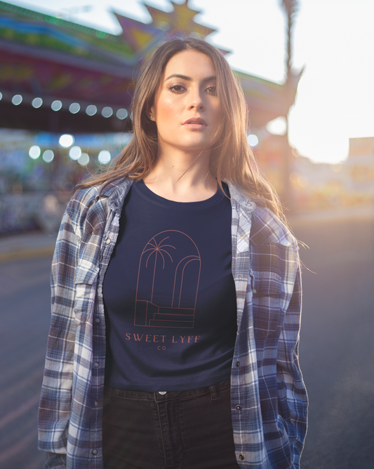 Wishing you were on a beach somewhere? Us too! This tropical cotton t-shirt has a minimalist design that inspires all things beachy. Made with a breathable cotton, you can rock this t-shirt in comfort and style.