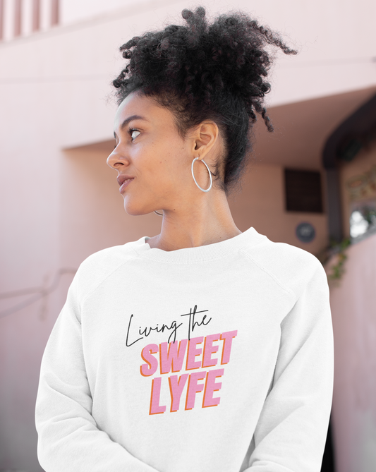 Living the sweet lyfe in a sunny state of mind. This crewneck sweatshirt gives off girly vibes. With light pink lettering, you can make your outfit pop and show off your trendy side at the same time. Put on this sweatshirt and let the compliments roll in and keep the good times going.