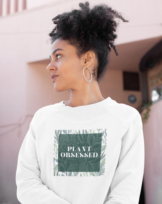 Calling all plant lovers. This plant obsessed crewneck sweatshirt has a gorgeous plant leaf design with the phrase Plant Obsessed. Whether you are just starting out your plant journey or your living space has become a jungle, this sweatshirt is for you.