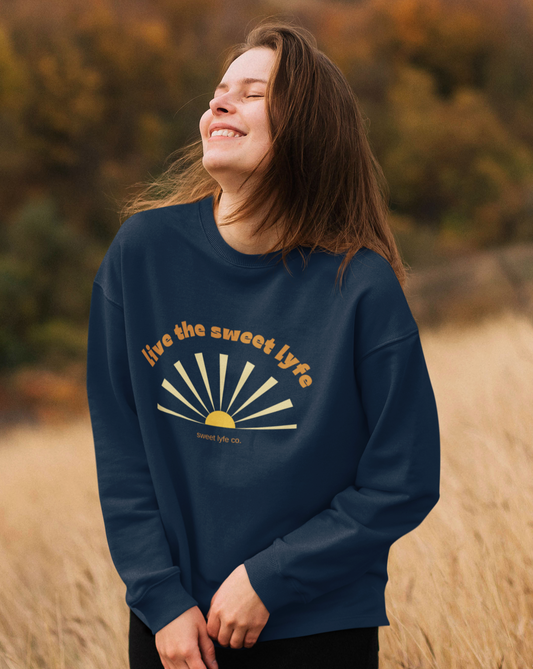 Sunshine is good for the mind, body, adn soul. Live the sunny sweet lyfe with this retro graphic crewneck sweatshirt. With both comfort and style in mind, this sweatshirt is made with a plush cotton that is great for sunny days. Step up your style and add this to your wardrobe today.