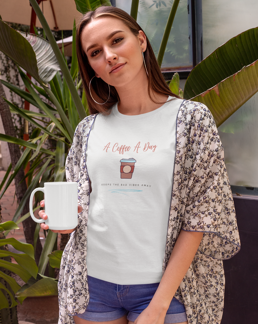 Keep the bad vibes away with a coffee (or two) a day. This funny coffee cotton t-shirt shows off your love for caffeine and made with a soft cotton material, you can stay comfy all day long. Designed for the girl who loves coffee and has great style.