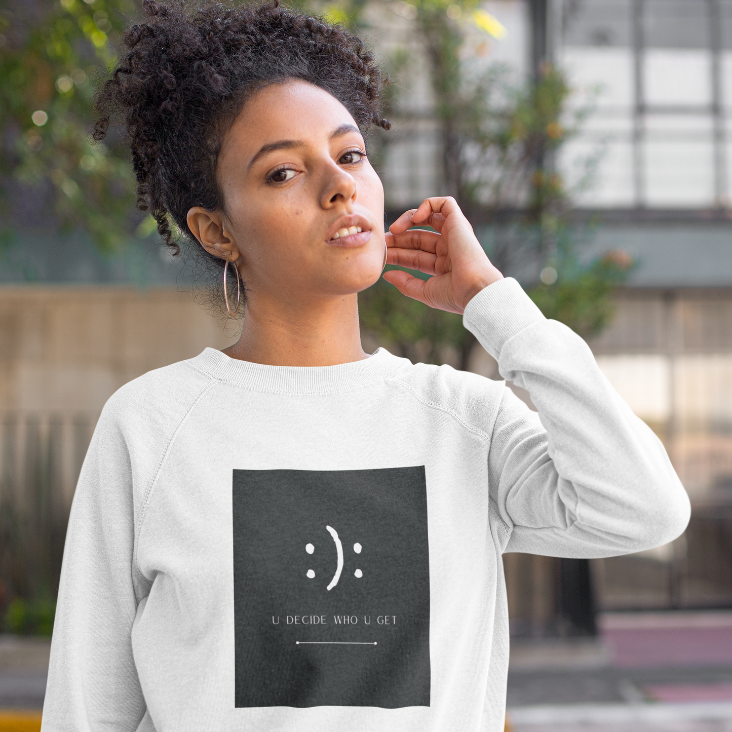 The you decide who you get smiley face crewneck sweatshirt is perfect for people who can't hide their emotions on their face.  This smiley face will let people know up front your personality in a fun and sassy way.  The edgy modern graphic will fit easily into your stylish wardrobe!